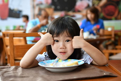 Portrait of boy eating food