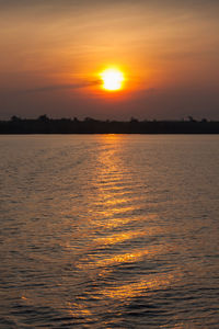 Scenic view of sea against romantic sky at sunset