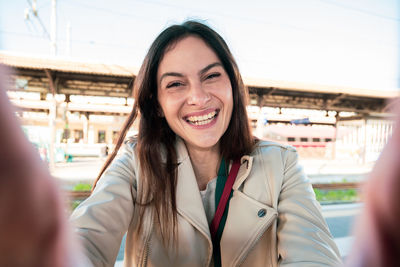 Portrait of smiling young woman looking away