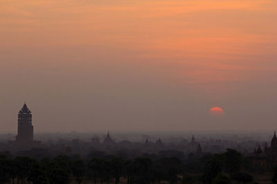 Buildings against sky during sunset