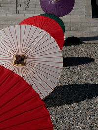 Colorful japanese-style umbrella arranged in row at temple