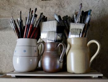 Close-up of paintbrushes on table