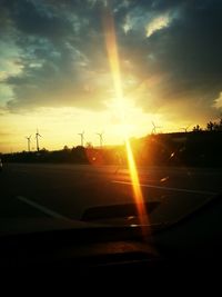 Sun shining over road