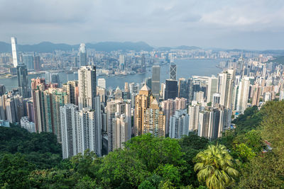 Aerial view of modern buildings in city against sky