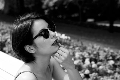 Close-up portrait of young woman wearing sunglasses