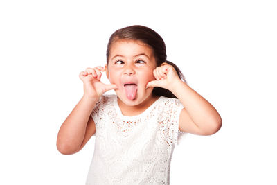 Portrait of smiling girl against white background