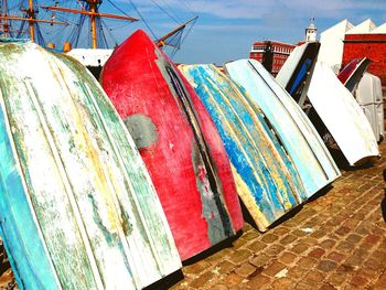 Wooden boats on cobblestone