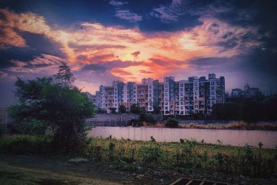 River against cloudy sky at dusk