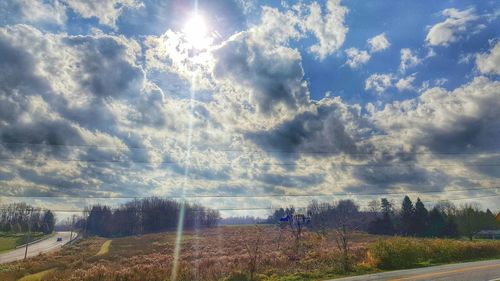 Scenic view of landscape against cloudy sky