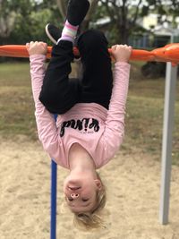 Low angle view of girl playing on playground