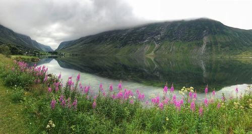 Scenic view of lake against cloudy sky