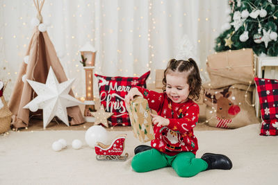 Portrait of boy playing with toys