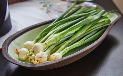 High angle view of vegetables in plate on table