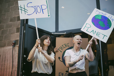 Female activist screaming while protesting for environmental issues