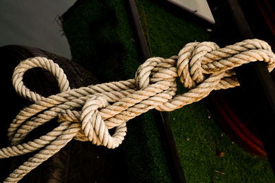 Close-up of rope tied on wooden post