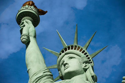 Low angle view of statue against cloudy sky