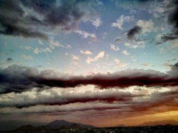 Scenic view of clouds over mountain against sky