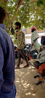 Rear view of people sitting outdoors