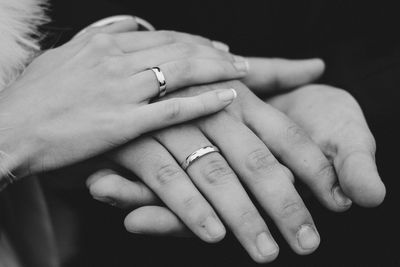 Midsection of couple holding hands