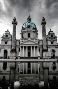 Low angle view of historical building against cloudy sky