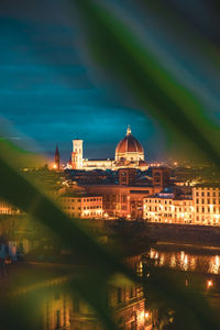 Illuminated buildings in city at night