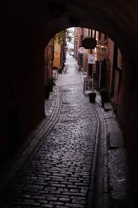 Narrow alley amidst buildings in city