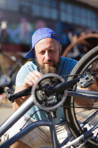 Portrait of man cycling on bicycle