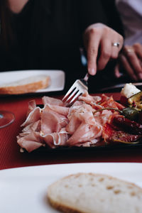 Midsection of preparing food on table