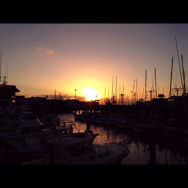 sunset, nautical vessel, moored, water, transportation, boat, mode of transport, sea, sun, harbor, orange color, mast, transfer print, reflection, sailboat, sky, nature, auto post production filter, beauty in nature, silhouette