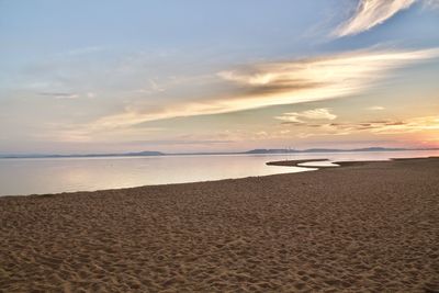Scenic view of beach against sky during sunset