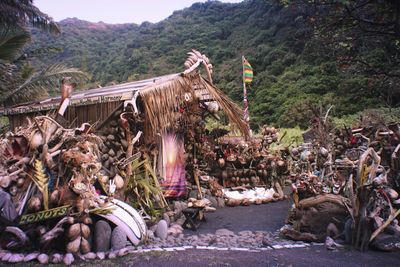 House on field against mountains