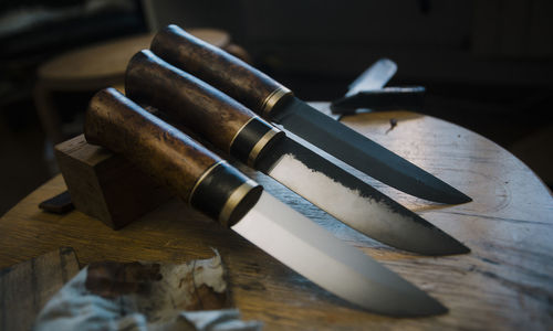 High angle view of metallic equipment on table