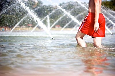 Woman jumping in water