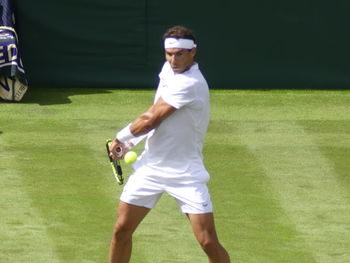 Full length of a man playing with ball