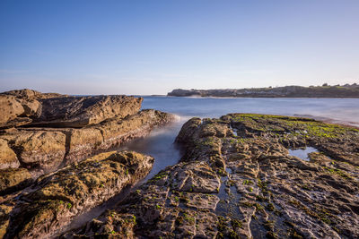 Scenic view of sea against clear sky
