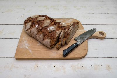 High angle view of bread on cutting board