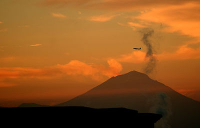 Low angle view of mountain against sky during sunset