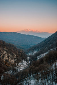 Scenic view of mountains against sky during sunset