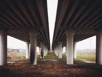 Low angle view of bridge over pathway
