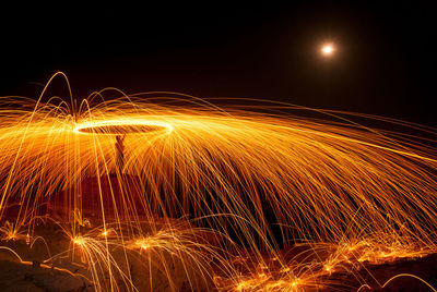 Light trails against sky at night