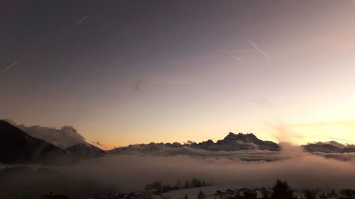 Scenic view of mountains against sky during sunset