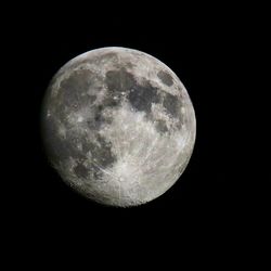 Low angle view of moon against clear sky at night