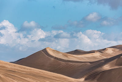 Panoramic view of desert against sky