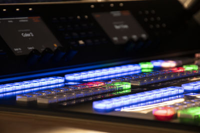 Close-up of colored buttons in a video mixer