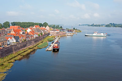 Aerial from the harbor and city woudrichem at the river merwede in the netherlands