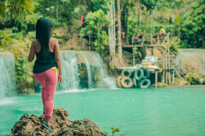 Rear view of woman in water