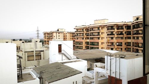 View of residential buildings against clear sky