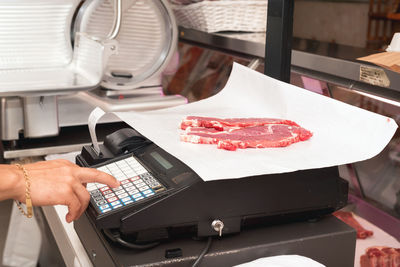 Midsection of man working on table