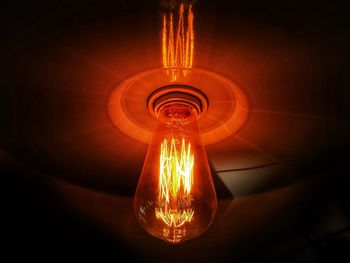 Close-up of illuminated light bulb