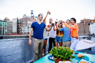 Friends celebrating at balcony